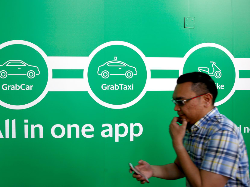 Grab has begun to test out a new membership based initiative that will offer passengers surge-free pricing for a month, for a flat membership fee. Photo: Reuters
