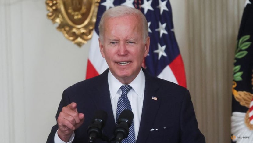 Biden signs inflation act, hands pen to Manchin 