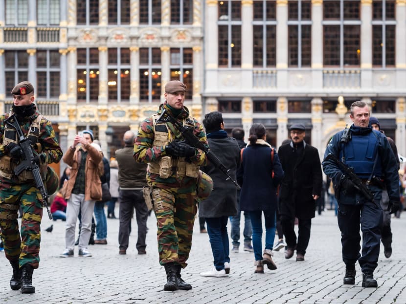 Belgian Army soldiers and police officers patrol in the picturesque Grand Place in the center of Brussels on Nov 20, 2015. Photo: AP