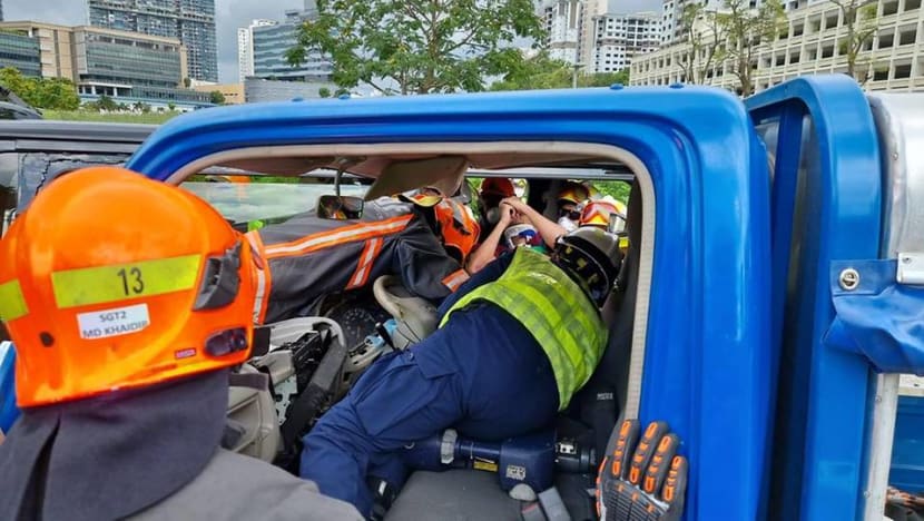 Lorry driver pinned in vehicle for nearly an hour after accident at Toh Guan Road Lorry driver pinned in vehicle for nearly an hour after accident at Toh Guan Road