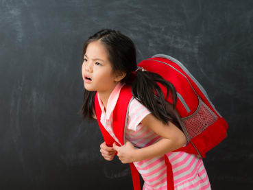Can poor posture and heavy bags really cause scoliosis in children – or is it something else?