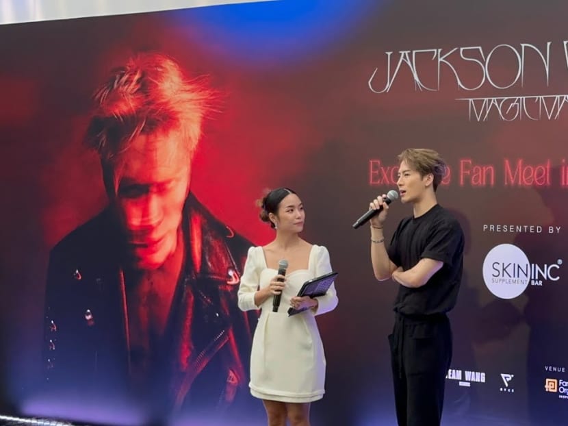 Magic Man singer Jackson Wang (right) and host Chow Jia Hui at an exclusive event for fans on Dec 21, 2022.