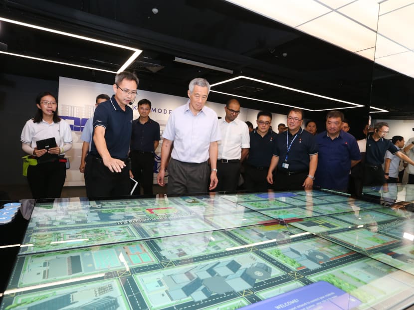 The launch of the public consultation document was witnessed by Prime Minister Lee Hsien Loong (front row, second from left), who also unveiled a revamped transport museum at the Land Transport Authority's office on Hampshire Road.