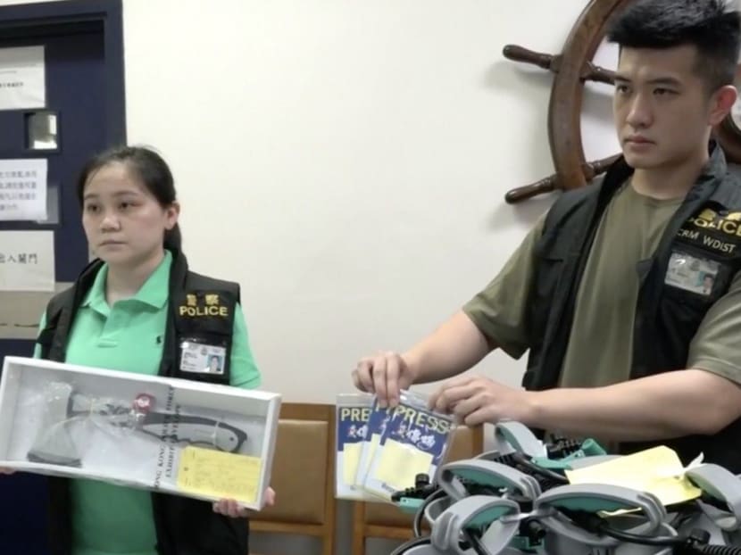 Police show press badges and various other gear confiscated from National Disaster Hardware Shop’s Sai Ying Pun pop-up storefront. Police show press badges and various other gear confiscated from National Disaster Hardware Shop’s Sai Ying Pun pop-up storefront.
