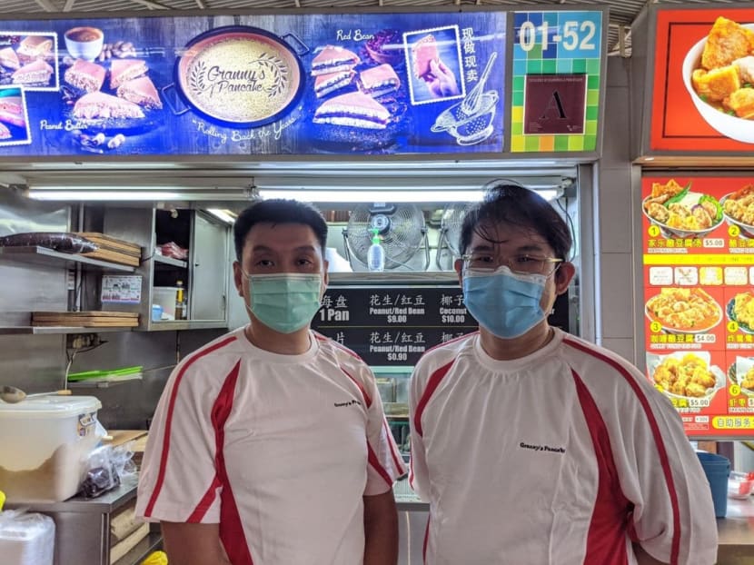 Mr Ken Chew (left) and Mr Steven Goh (right) in front of Granny’s Pancake hawker stall, where they did their apprenticeship under the Hawkers’ Development Programme.