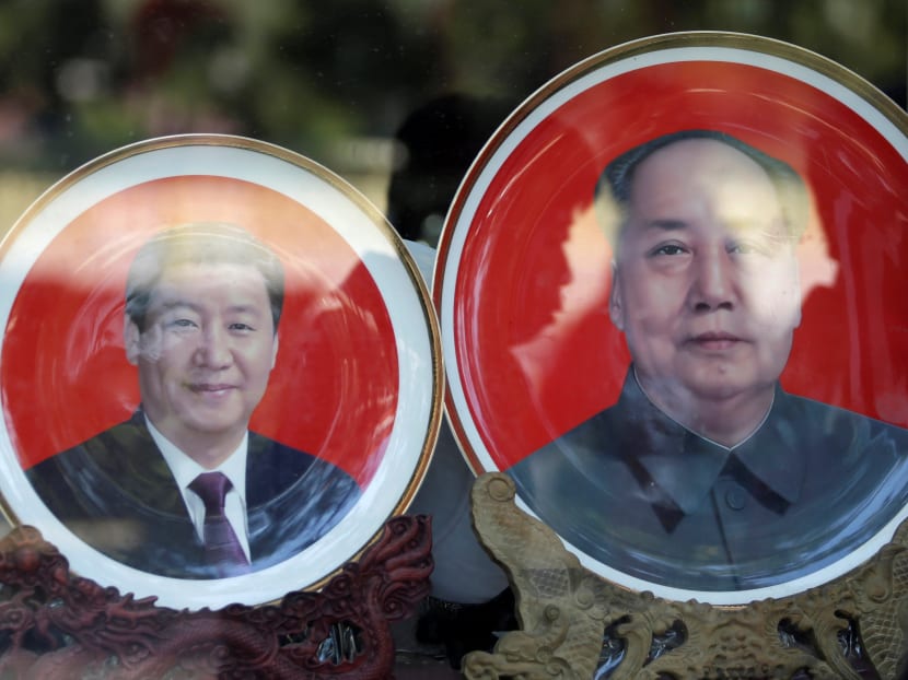 Souvenir plates with images of Chinese late Chairman Mao Zedong and Chinese President Xi Jinping are displayed for sale at a shop next to Tiananmen Square during the ongoing Communist Party congress. Mr Xi is now regarded as China’s great centraliser and most powerful ruler since Mao. Photo: Reuters