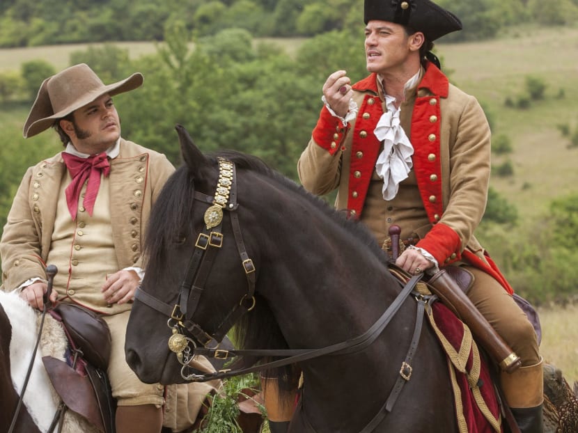 Josh Gad (left, as Le Fou) and Dan Stevens (Gaston) in a scene from Beauty And The Beast. Photo: Disney