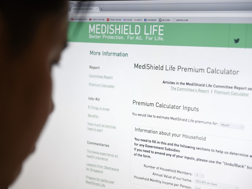 This illustrative picture shows a man looking at MOH's MediShield Life Premium Calculator microsite. TODAY file photo