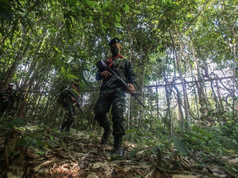 Thai security forces patrol in the forest near the Thailand-Malaysia border in Sadao district in southern Songkhla province on March 31, 2022.
Thai security forces patrol in the forest near the Thailand-Malaysia border in Sadao district in southern Songkhla province on March 31, 2022.