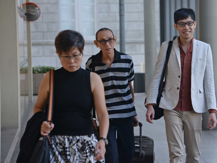 Mr Roy Ngerng (right) walking into the Supreme Court, on July 3, 2015. Photo: Robin Choo
