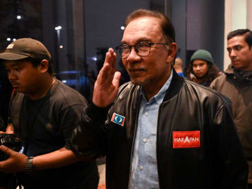 Pakatan Harapan chairman Anwar Ibrahim (centre) reacts at the end of a press conference in Kuala Lumpur on Nov 20, 2022.