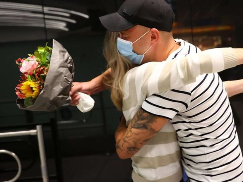 German-Brazilian couple hug again after coronavirus separation German-Brazilian couple hug again after coronavirus separation