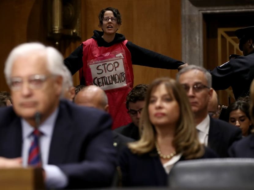 A supporter of Palestinian rights disrupts the confirmation hearing of Mr David Friedman, US President Donald Trump's nominee to be the next US ambassador to Israel, as Mr Friedman testifies before the Senate Foreign Relations Committee on Feb16, 2017 in Washington, DC. Photo: AFP