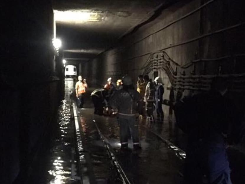 A malfunctioning water pumping system allowed rain water to build up in the train tunnel near Bishan MRT station, which resulted in a massive disruption along the North South Line (NSL) at the weekend. Photo: SCDF