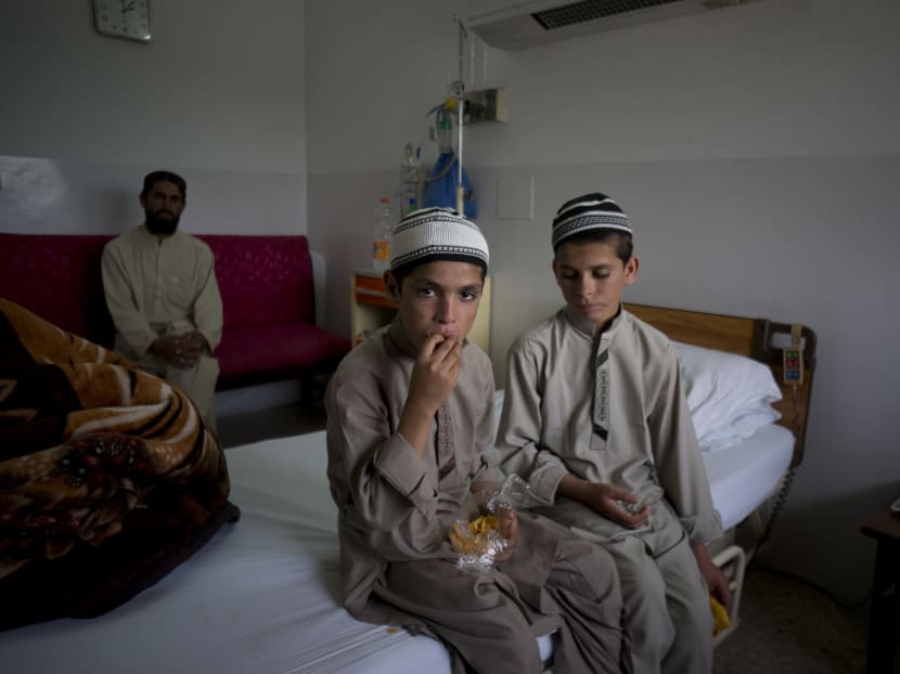 Gallery: Solar kids: Pakistan treating 2 brothers who become paralysed every night
