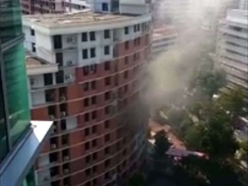 Screengrab of YouTube video by Karen Lau showing the SCDF putting out the fire at Block 158, Hougang Street 11.
