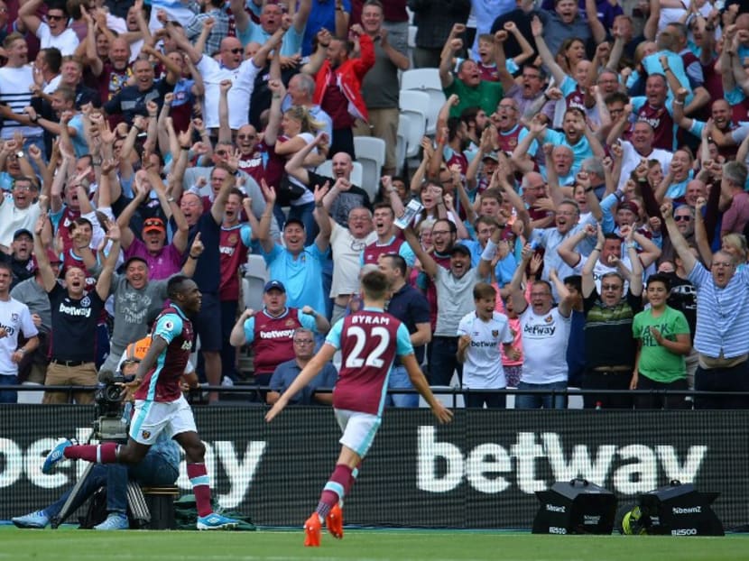 West Ham United's English midfielder Michail Antonio celebrates after scoring the opening goal against Bournemouth at The London Stadium on August 21, 2016, West Ham's first home fixture in their new stadium. Photo: AFP