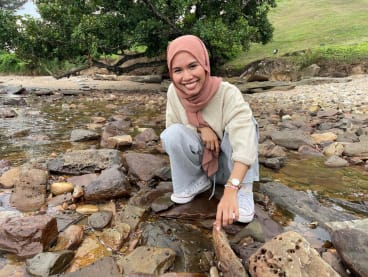 The writer (pictured) on a field trip along Brunei’s rocky shores. 