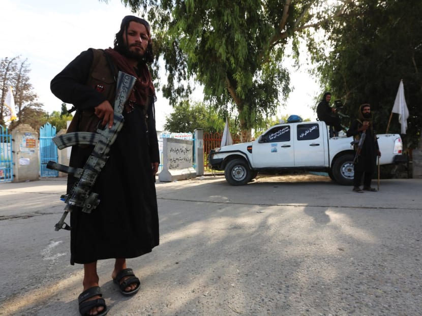 Taliban security forces stand guard along a roadside in Jalalabad on Oct 6, 2022.
