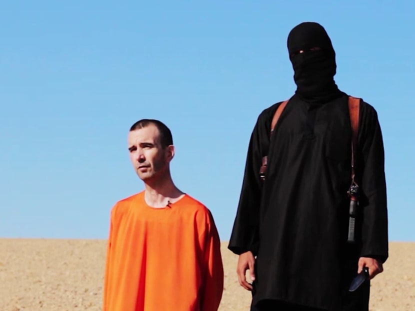 EDS NOTE: GRAPHIC CONTENT - This image made from video posted on the Internet by Islamic State militants and provided by the SITE Intelligence Group, a U.S. terrorism watchdog, on Saturday, Sept. 13, 2014, purports to show British aid worker David Haines before he was beheaded. The video emerged hours after the family of Haines issued a public plea on Saturday urging his captors to contact them. The 44-year-old Haines was abducted in Syria in 2013 while working for an international aid agency. (AP Photo)