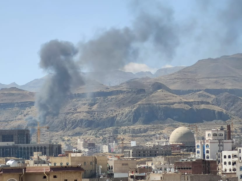 Smoke billows from the site of a Saudi-led air strike in Sanaa, Yemen on Nov 27, 2020. Singaporean Sheik Heikel Khalid Bafana, 48, assisted one of the factions in the civil war while living in Yemen and volunteered to take up arms to fight alongside this faction while there.