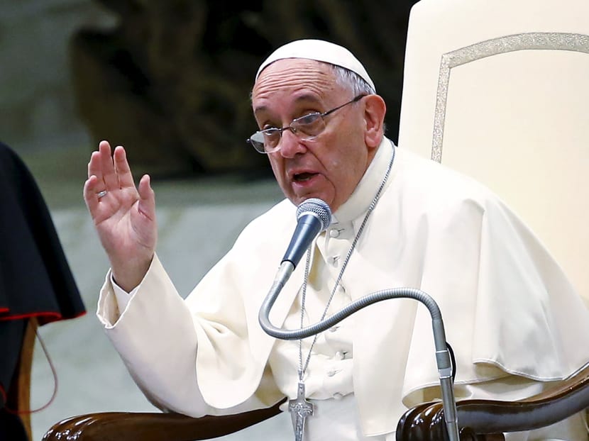 Pope Francis gestures as he talks during a special audience with members of "Eucharist Youth Movement" in Paul VI hall at the Vatican. Photo: Reuters
