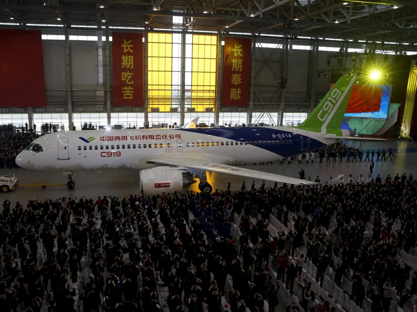 The first C919 passenger jet made by the Commercial Aircraft Corp of China (Comac) is pulled out during a news conference at the company's factory in Shanghai on Nov 2, 2015. Photo: Reuters