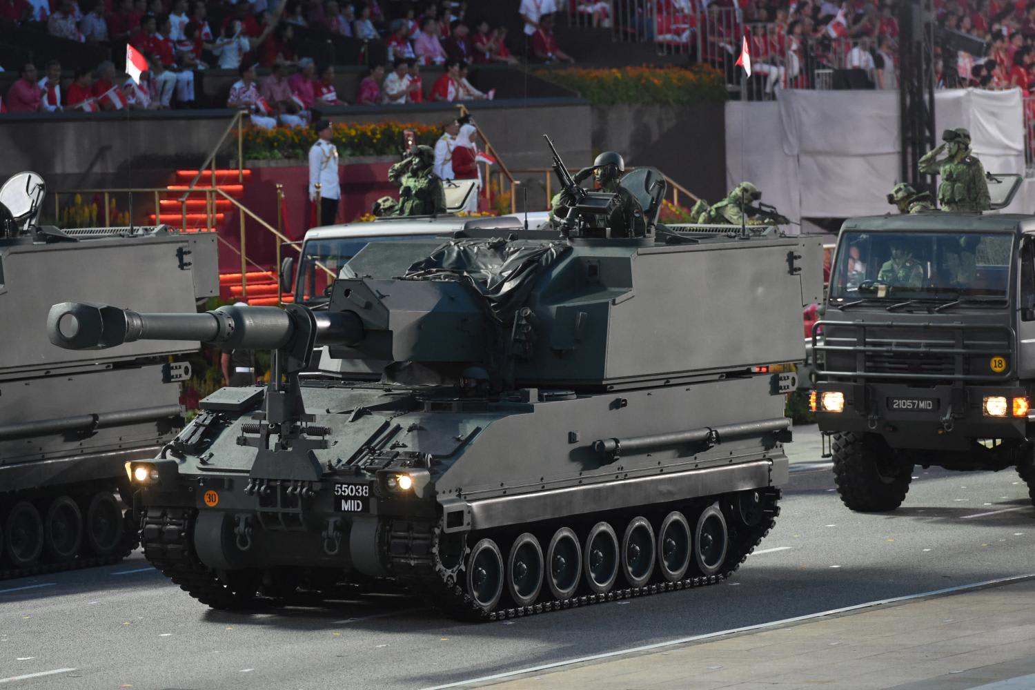 Soldiers salute from their military vehicles during the 54th National Day Parade in Singapore on Aug 9, 2019. Soldiers salute from their military vehicles during the 54th National Day Parade in Singapore on Aug 9, 2019.