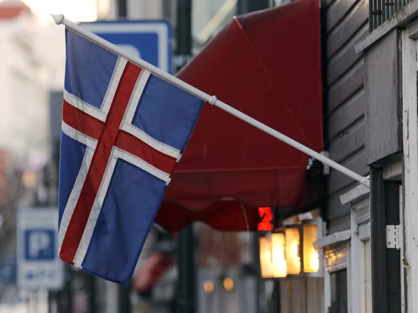 An Icelandic flag hangs outside a shop in Reykjavik, Oct 27, 2016. Photo: AP