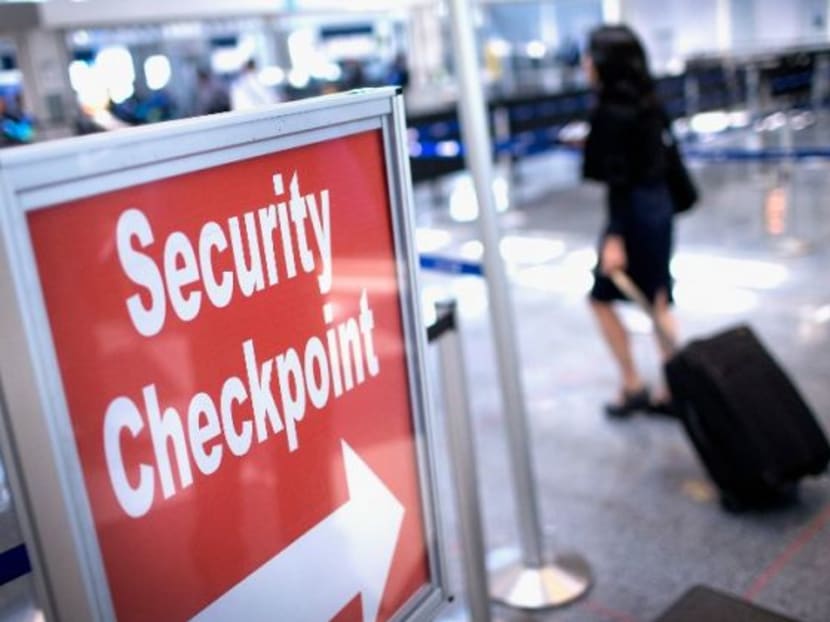 A sign directing travellers to a security checkpoint at Chicago's O'Hare Airport. Photo: AFP