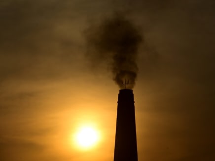 In this file photo taken on March 15, 2023, smoke billows from a brick factory chimney on the outskirts of Prayagraj in India. On March 20, 2023, UN Secretary General Antonio Guterres called on wealthy countries to move up their goals of achieving carbon neutrality to "defuse the climate time bomb".
