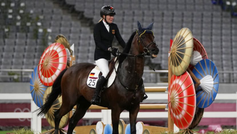 Olympics: Germany's modern pentathlon coach disqualified after punching horse Olympics: Germany's modern pentathlon coach disqualified after punching horse