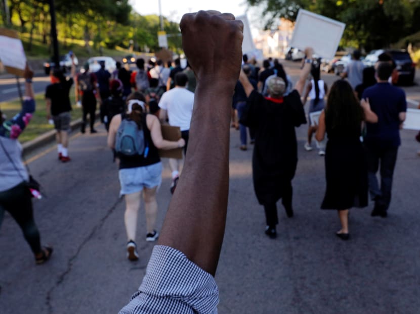 Marchers take part in a Juneteenth Awareness Walk to demonstrate against racial inequality in the aftermath of the death in Minneapolis police custody of George Floyd, in Boston, Massachusetts, US, June 18, 2020.