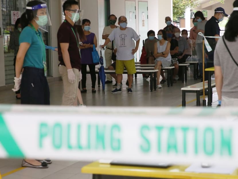 Voters waiting at a polling station at Chung Cheng High School (Main) on July 10. The author says the ELD statement on Sept 10 on its findings on why there were abnormally long queues at some polling stations "could have shed more light".