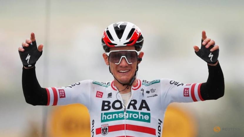 Cycling-Konrad soloes to Tour stage win as top guns keep powder dry