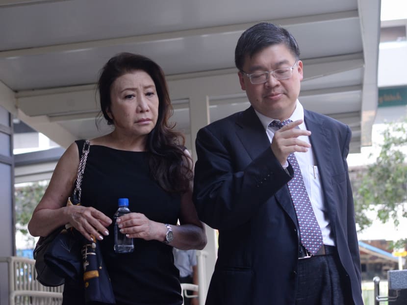 Shi Ka Yee (left) at the State Courts with her lawyer. TODAY file photo
