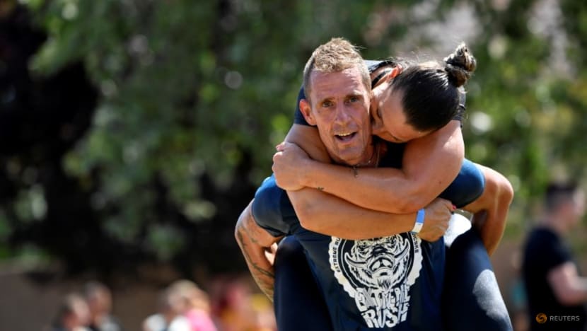 Hungarians grab their partners in nation's wife-carrying contest Hungarians grab their partners in nation's wife-carrying contest