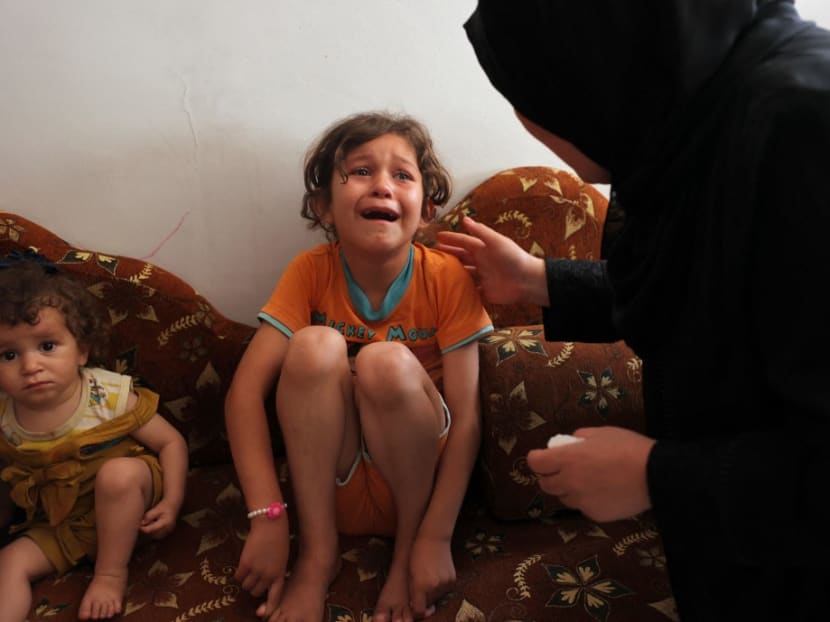 A relative cries during the funeral of an 11-year-old Palestinian girl who died following an Israeli air strike amid Israeli-Palestinian fighting, in Jabalia, in the northern Gaza Strip, on May 20, 2021.