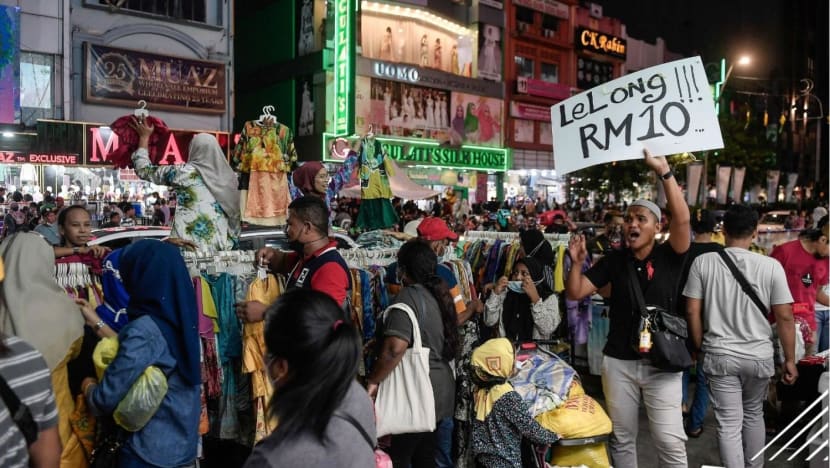 Shoppers in Malaysia rush to prepare for earlier Hari Raya Puasa