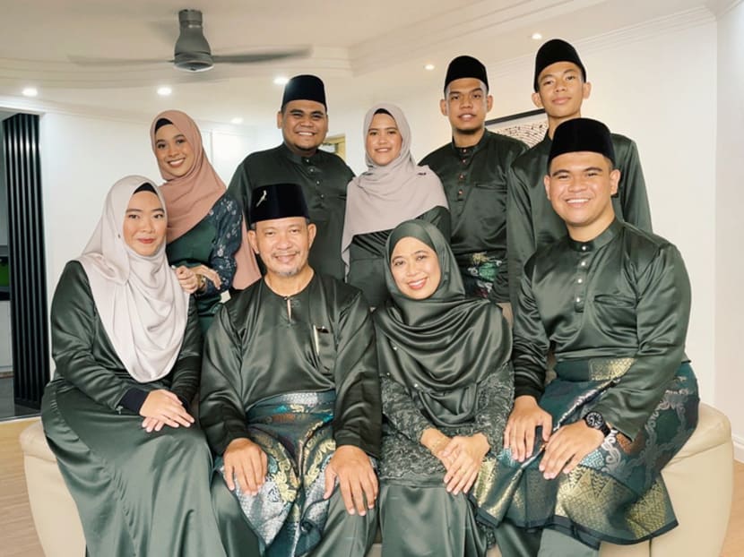 Madam Suriyani Muhamad Buang, 53, (second from right in front row), her husband, Mr Abu Bakar Abdul Rahim, 57, on her right, with other members of their family. 