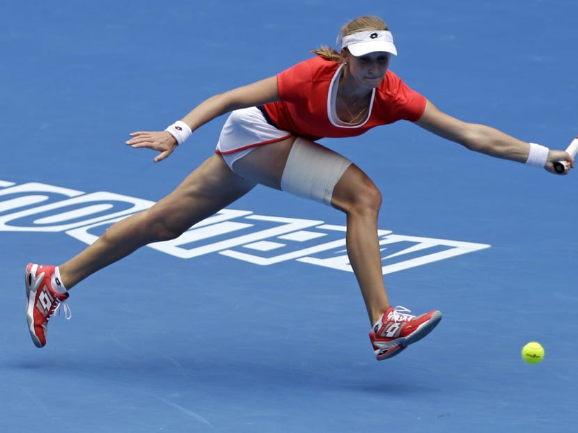 Ekaterina Makarova of Russia chases down a shot to Simona Halep of Romania during their quarter-final match at the Australian Open tennis championship in Melbourne, Australia, Jan 27, 2015. Photo: AP