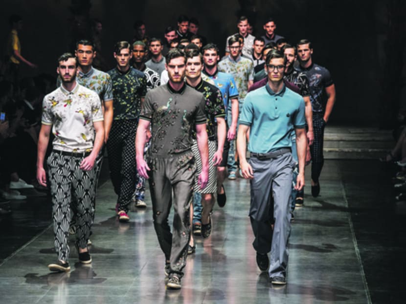 While men strutted at the catwalk, the real action was outside. Photo: AP
