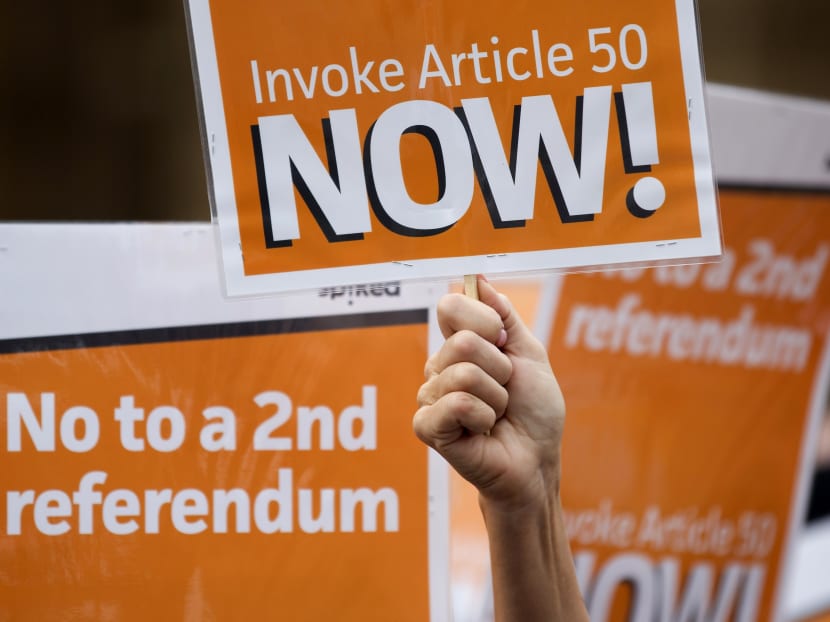 Pro-Brexit demonstrators, calling on the British government to invoke article 50 immediately, and urging them not to hold a second referendum, shout slogans and hold placards as they protest outside the Houses of Parliament in London on September 5, 2016. AFP file photo