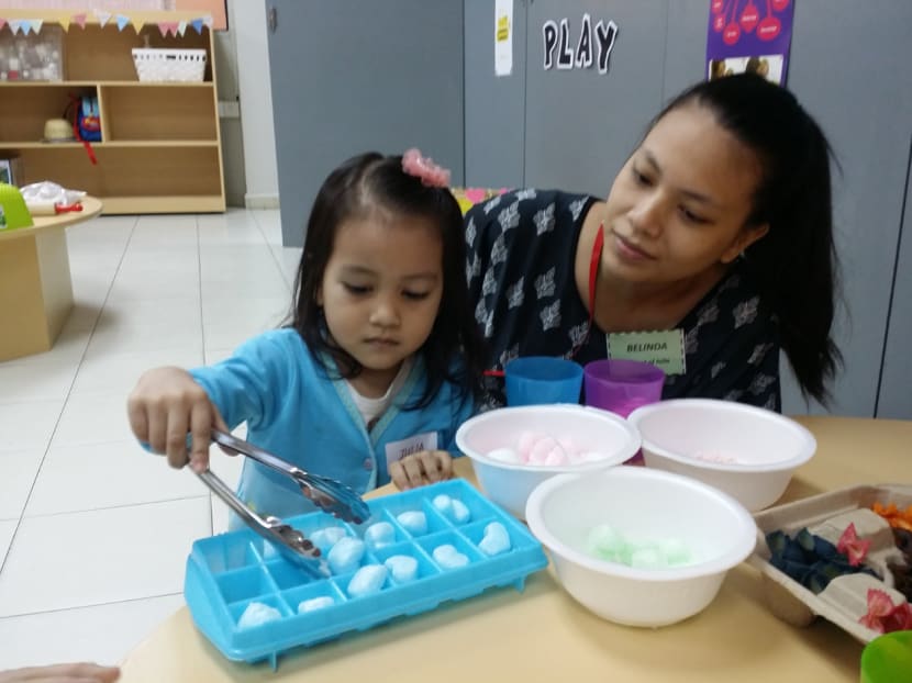 Housewife Belinda Mohd Azmi and her three-year-old daughter Julia pictured at one of the playgroup sessions as part of the KidSTART Group programme.  Photo: ECDA