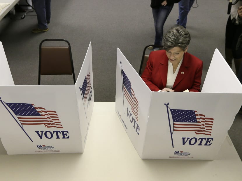 Republican Senate candidate State Sen. Joni Ernst casts her ballot in the general election. Photo: AP
