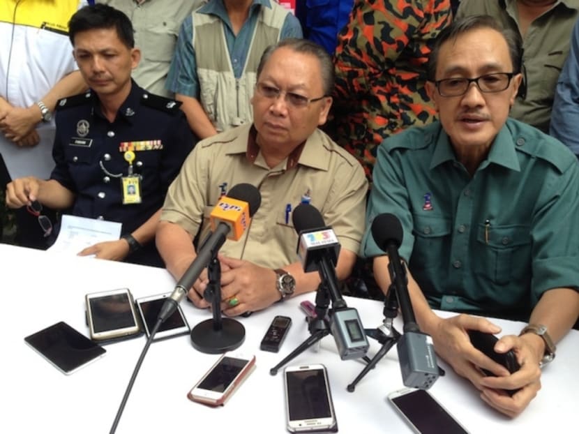 Sabah Deputy Chief Minister Pairin (centre) said he had a premonition that something bad was going to happen earlier this week when he saw a flight of swallows circling outside his house during breakfast. Photo: The Malay Mail Online