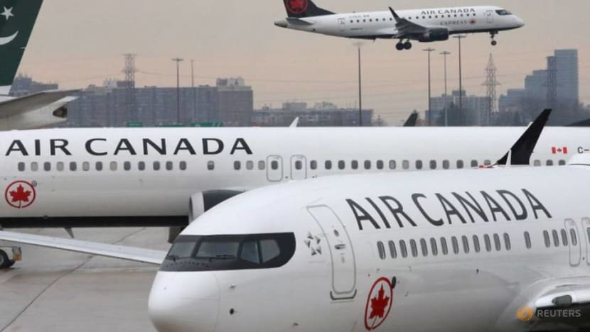 Air Canada to lay off half its workforce as virus bites Air Canada to lay off half its workforce as virus bites