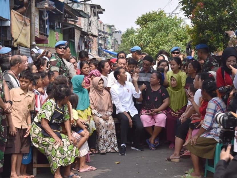 Mr Widodo with some Jakarta residents in May. In recent months, he has spent more time at the Bogor Palace, conducting official state business and hosting foreign guests there.