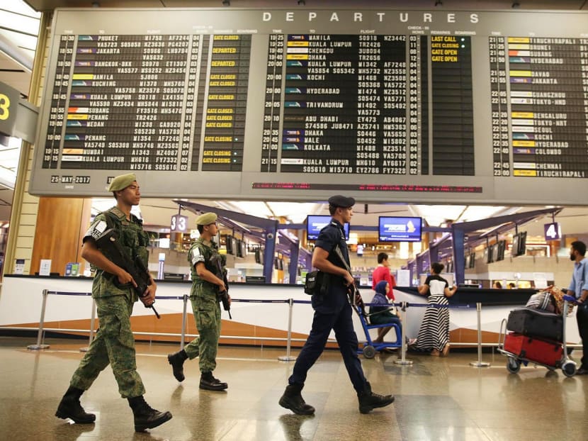 Airport security patrolling Changi Airport. The job of safeguarding the nation’s security cannot be left to the armed services alone but must involve all Singaporeans.  TODAY file photo