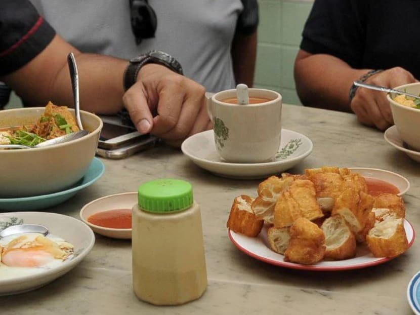 Malaysians having breakfast at a coffeeshop. Malaysians are complaining that it is more expensive to quench their thirst than to get a litre of petrol for their rides. New Straits Times file photo